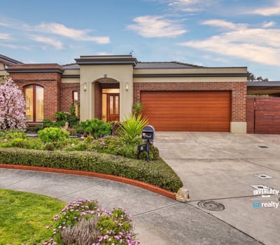 Discover this inviting home featuring lush landscaping, a spacious driveway, and ample natural light throughout.