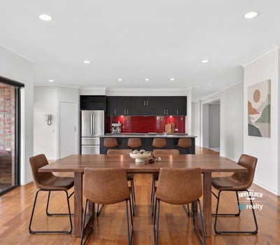 Modern kitchen and dining area with sleek finishes, perfect for entertaining and everyday living.