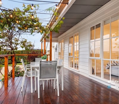 Inviting outdoor space with string lights, perfect for entertaining or relaxing in the fresh air.