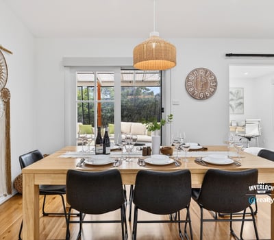 Bright dining area featuring natural wood accents, perfect for gatherings and everyday meals with family.