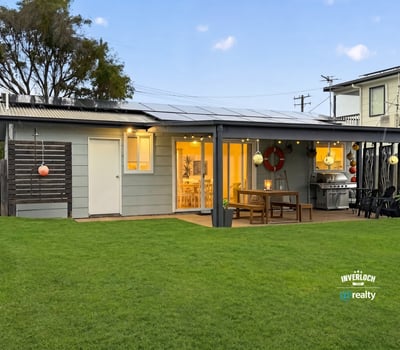 This modern home features a spacious yard, inviting patio area, and ample natural light throughout.