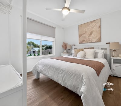 This inviting bedroom features a spacious layout, abundant natural light, and contemporary decor for comfortable living.