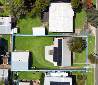 Spacious lot with ample outdoor space, featuring a well-maintained home and multiple storage options close to amenities.