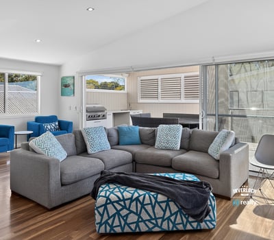 Bright and airy living space featuring modern furnishings and seamless indoor-outdoor flow for easy entertaining.