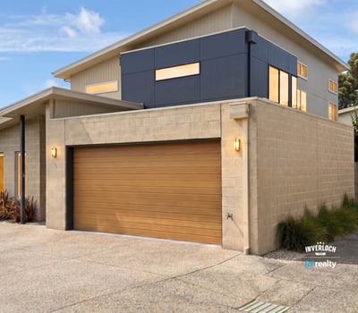 Modern two-story home featuring spacious interiors and a unique architectural design, perfect for contemporary living.