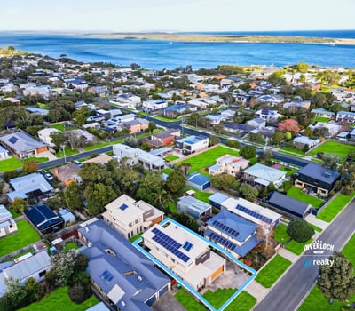 Experience coastal living with this modern home in a vibrant community, offering breathtaking water views.