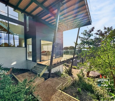 Modern architectural design features expansive outdoor views and vibrant landscaping for a unique living experience.