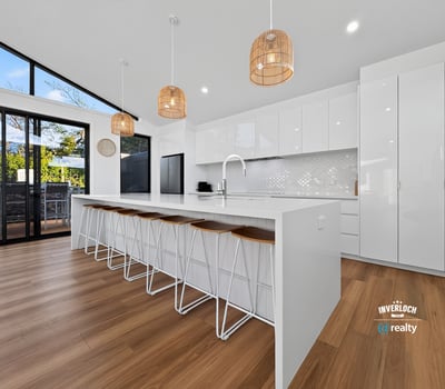 Modern kitchen featuring spacious design, sleek cabinetry, and ample natural light, perfect for entertaining.