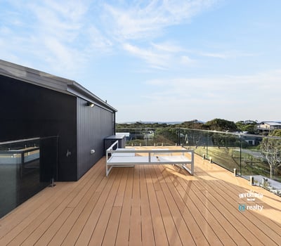 Enjoy breathtaking views from this spacious deck, perfect for outdoor gatherings and relaxation.
