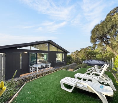 Contemporary home featuring lush outdoor space, perfect for entertaining and enjoying scenic views.