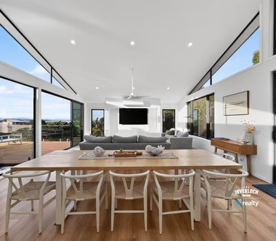 Contemporary open-plan living space featuring abundant natural light and stunning views, ideal for entertaining.
