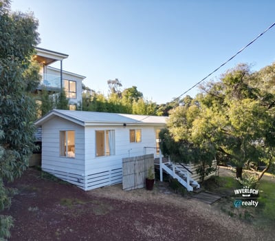 Cozy retreat nestled among lush greenery, offering a peaceful atmosphere and comfortable living space.