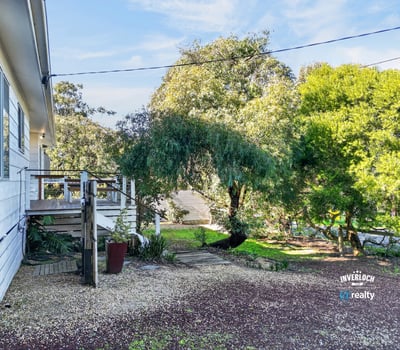 This property features a spacious outdoor area, perfect for relaxation and entertaining amidst lush greenery.