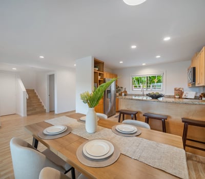 Bright and airy kitchen-dining area featuring modern finishes and ample space for gatherings.