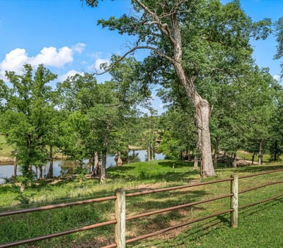 Scenic property featuring lush greenery and peaceful views of a tranquil river, ideal for nature enthusiasts.