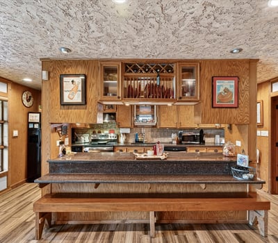 This inviting kitchen features ample counter space and a unique design, perfect for gatherings and culinary creativity.