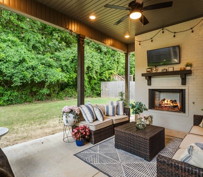 Covered outdoor living space with gas fireplace