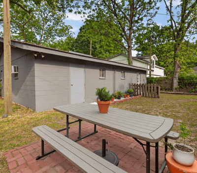 Spacious outdoor area features a picnic spot, perfect for gatherings and enjoying the natural landscape.