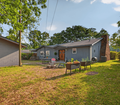 Discover a spacious backyard perfect for gatherings, featuring ample space and unique landscaping opportunities.