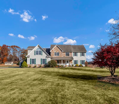 Set back from the street on 1.8 open, level-perfect acres.