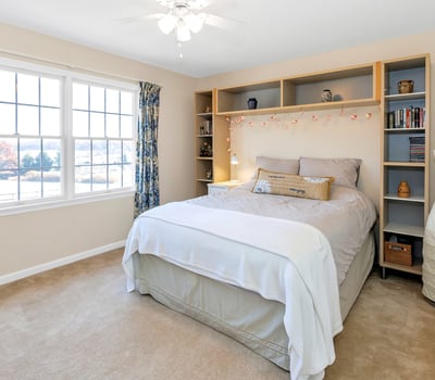 Bedroom 4 is a bright room with backyard view, fan/light, and closet.