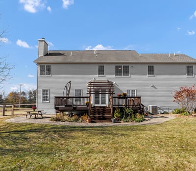 The view from the yard to the home highlights the attractive, enjoyable outdoor space.