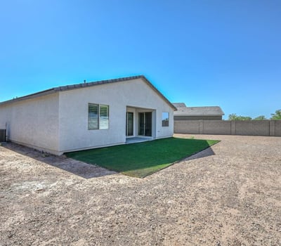 This expansive backyard blends artificial turf with open gravel space ready for your outdoor vision. Whether you dream of a pool, garden, or patio build, this Peoria lot offers a blank canvas with privacy fencing already in place.