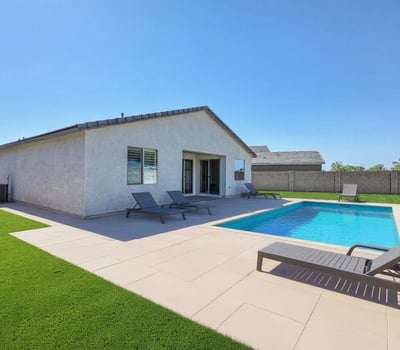 Virtually staged to showcase potential, this backyard rendering highlights space for a pool and lounging area. Imagine relaxing poolside in your custom-designed outdoor escape, right here in the heart of Peoria.