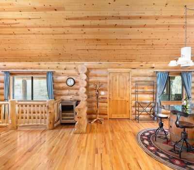 Dining area with bar seating, wood accents, and open sightlines ideal for hosting guests and enjoying everyday meals.