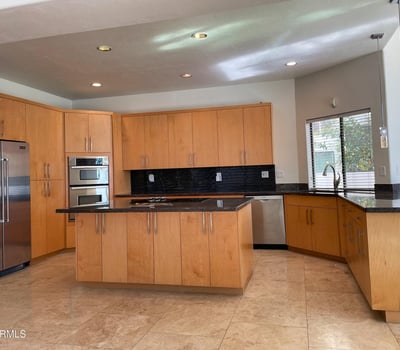 Open kitchen featuring premium appliances, wraparound counters, and generous storage combining practicality with modern elegance.