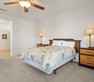 This bright and spacious primary suite combines comfort and function, with direct access to the ensuite bath and generous natural lighting.