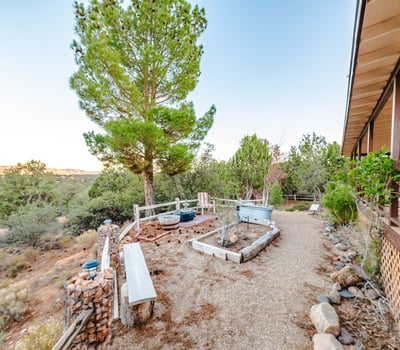 This covered deck provides a cool, comfortable place to unwind while overlooking the property s natural desert landscape. Sliding door access enhances indoor outdoor flow throughout the home.