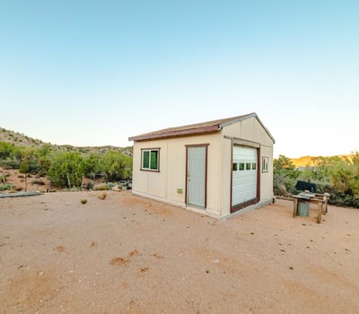 Set against acres of open land, this detached shed is perfect for workshop needs, storage, or equipment use. Its placement offers privacy and sweeping Hackberry views.