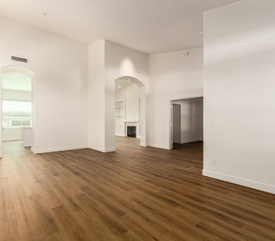Dramatic vaulted ceilings and clean modern finishes highlight this spacious Scottsdale living area. The open design and large windows create a bright environment ideal for relaxing or entertaining.