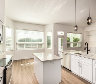 Bright Scottsdale dining area adjacent to the updated kitchen with large windows and views of the backyard. The open layout and modern finishes create an inviting environment for meals and gatherings.