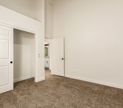 Additional bedroom with natural light, plush carpet, and neutral tones. The flexible Scottsdale space works well as a guest room, office, or additional living area.