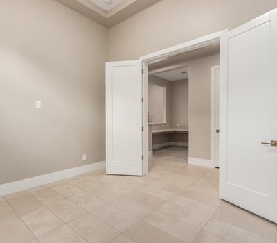 Flexible interior room that adapts easily to a home gym, office, or creative studio, adding versatility to this Cave Creek home.
