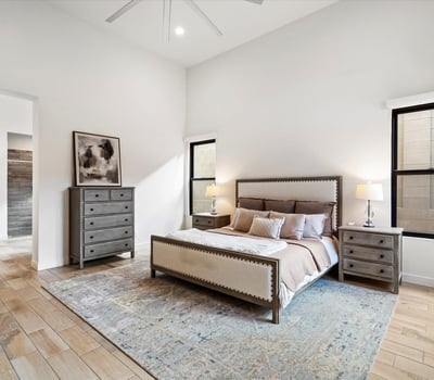 Generously sized primary bedroom with soft natural light and neutral design elements. A calm, inviting retreat in this Scottsdale luxury home.