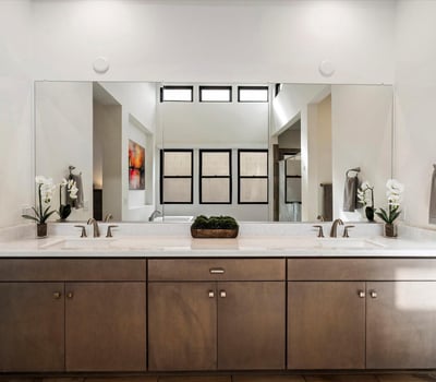 Contemporary primary bathroom with dual vanities, sleek hardware, and ample counter space. Designed for everyday luxury living in Scottsdale.