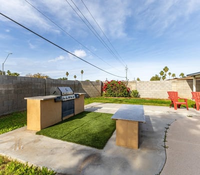 Built-in BBQ station with prep counter space, perfect for cookouts and entertaining by the pool an outdoor feature buyers love in Phoenix real estate.