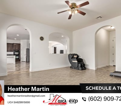 Arched architectural details frame this open living space connecting seamlessly to the kitchen. The updated floors and neutral palette make this Glendale home move-in ready.
