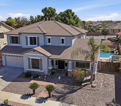 Drone perspective highlighting the beautiful Queen Creek home with a private pool and spa backyard, desert landscaping, and spacious lot within the desirable Cortina neighborhood.