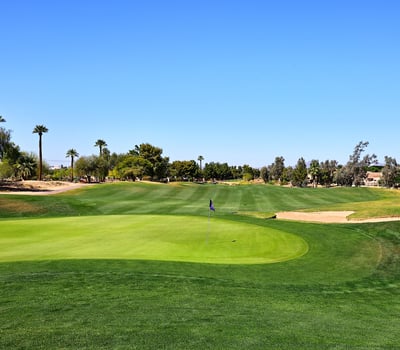 Golf course featuring pristine greens, sand bunkers, and open fairways. This Phoenix community offers a scenic and active outdoor lifestyle.