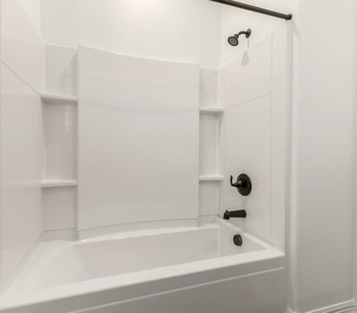 Full bathroom with tub and shower combination, updated finishes, and clean design for convenience and comfort.