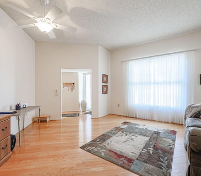Large bonus room with natural light and open layout, perfect for a home office, hobby room, or additional living space.