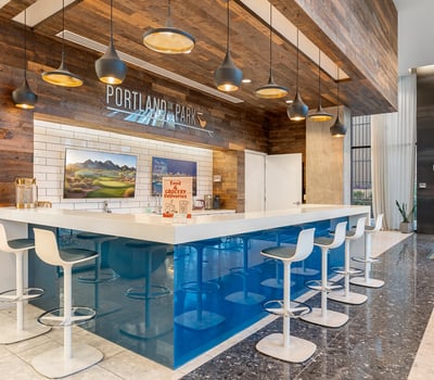 Spacious lounge with integrated bar and modern seating, designed for entertaining and relaxation in Phoenix