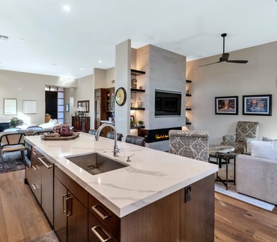 Spacious layout combining kitchen, dining, and living areas with a large island and modern finishes in this Phoenix property.