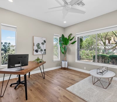 Bright Scottsdale office with large windows, wood flooring, and flexible layout ideal for work-from-home or study space.