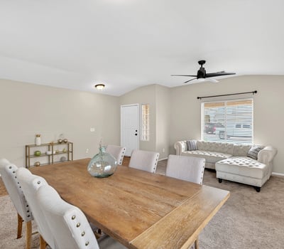 Flexible dining and living area with neutral tones and natural light. Open-concept layout enhances everyday living and entertaining in this Casa Grande home.