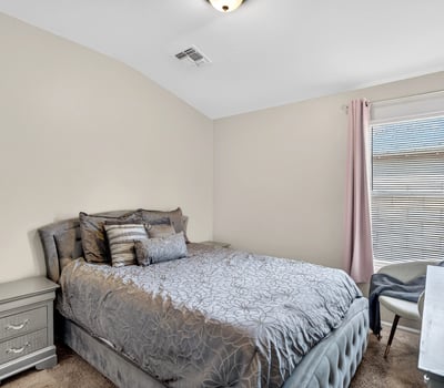Secondary bedroom offering comfort, natural light, and versatility. Ideal for guests or family in this Casa Grande property.
